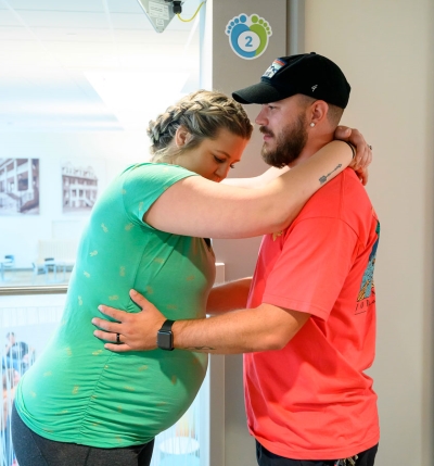 soon to be mother slow dancing with husband